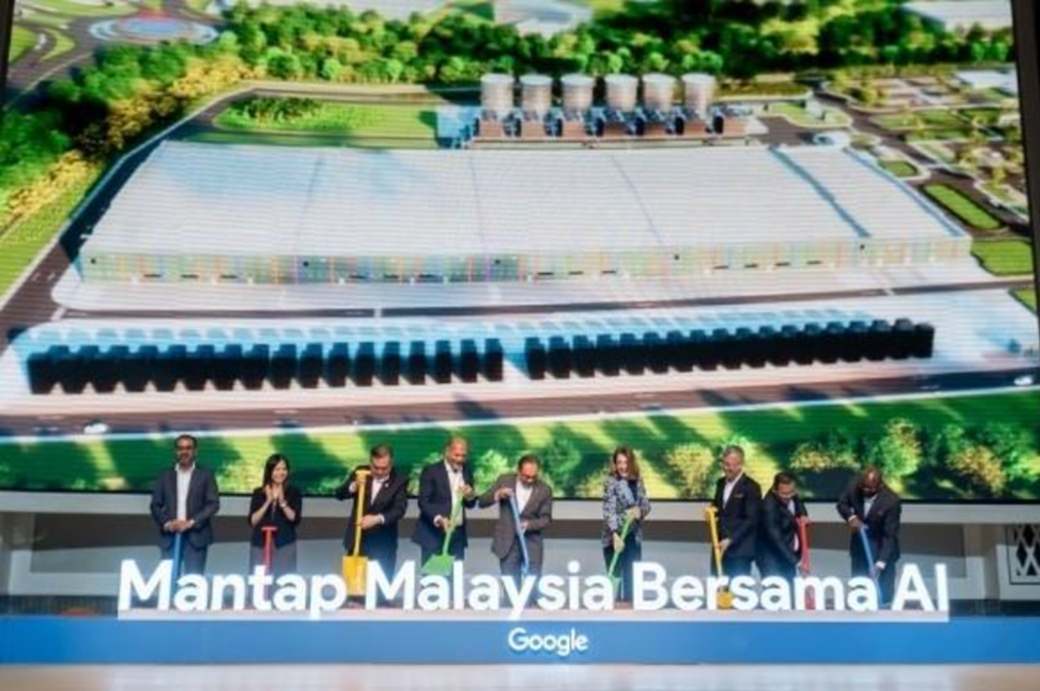 Executives participating in the groundbreaking ceremony for Google’s first data centre in Malaysia at Elmina Business Park, shown in front of a large project visualization screen.